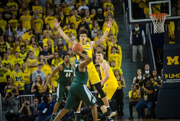 D.J. Wilson (5) and Moritz Wagner (13)