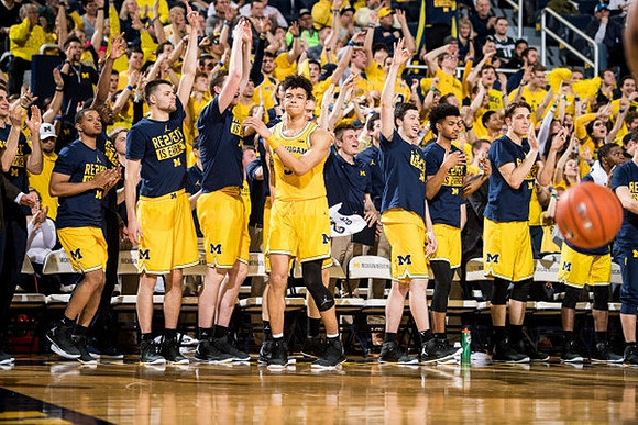 D.J. Wilson (5) and Michigan Team