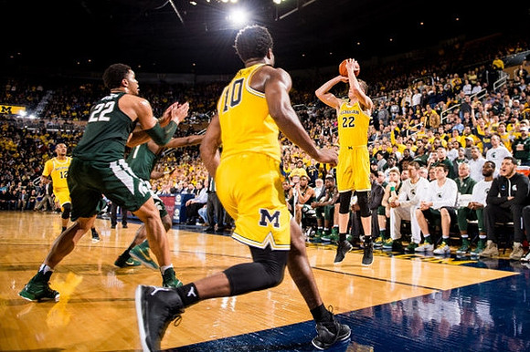 Muhammad-Ali Abdur-Rahkman (12), Derrick Walton Jr. (10), and Duncan Robinson (22)
