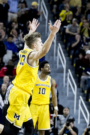 Moritz Wagner (13) and Derrick Walton Jr. (10)