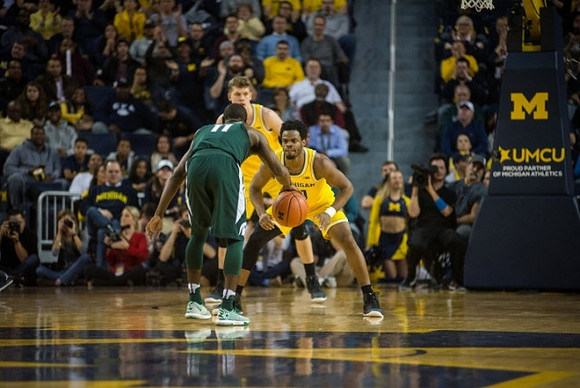 Moritz Wagner (13) and Derrick Walton Jr. (10)