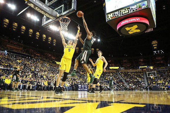 D.J. Wilson (5) and Moritz Wagner (13)