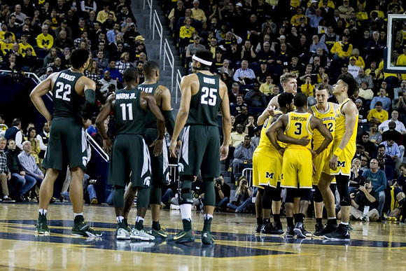 Derrick Walton Jr. (10), Xavier Simpson (3), Moritz Wagner (13), Duncan Robinson (22), and D.J. Wilson (5)