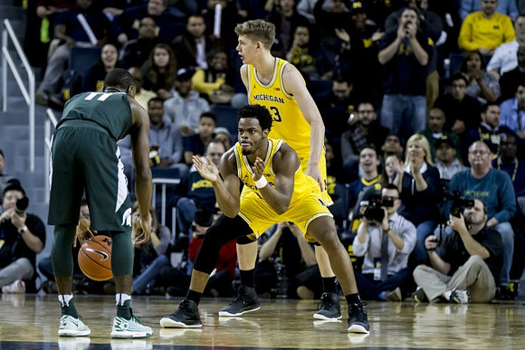 Derrick Walton Jr. (10) and Moritz Wagner (13)