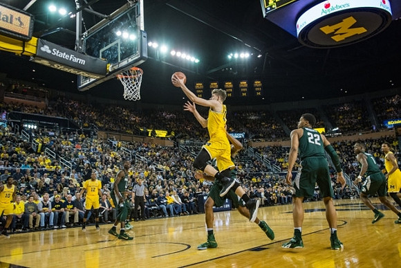 Muhammad-Ali Abdur-Rahkman (12), Moritz Wagner (13), and Zak Irvin (21)