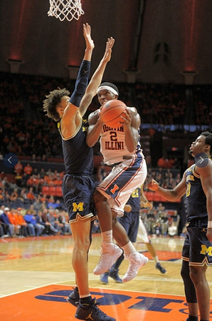 D.J. Wilson (5) and Derrick Walton Jr. (10)