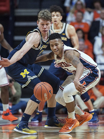Moritz Wagner (13) and D.J. Wilson (5)