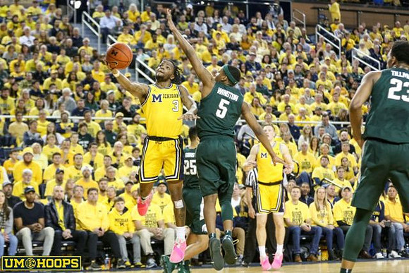 Zavier Simpson (3) and Ignas Brazdeikis (13)