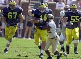 Andy Mignery (14), Matt Lentz (67), and OL Andy Christopfel (55)