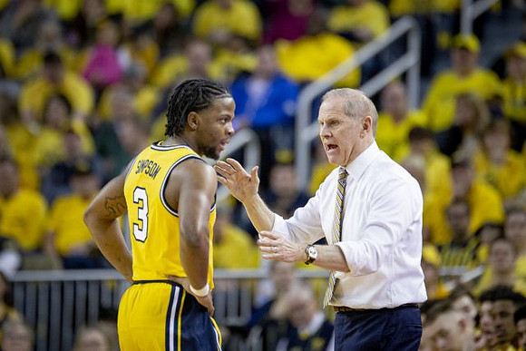 Zavier Simpson (3) and John Beilein