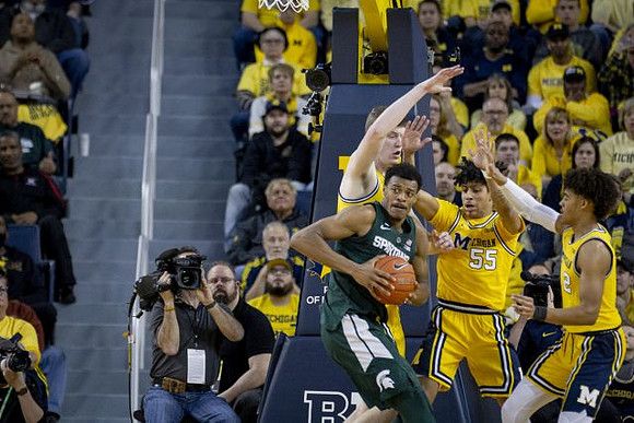 Eli Brooks (55) and Jordan Poole (2)