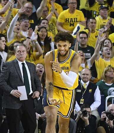 Isaiah Livers (4) and Michigan State Head Coach Tom Izzo