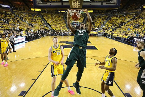 Isaiah Livers (4), Jon Teske (15), and Zavier Simpson (3)