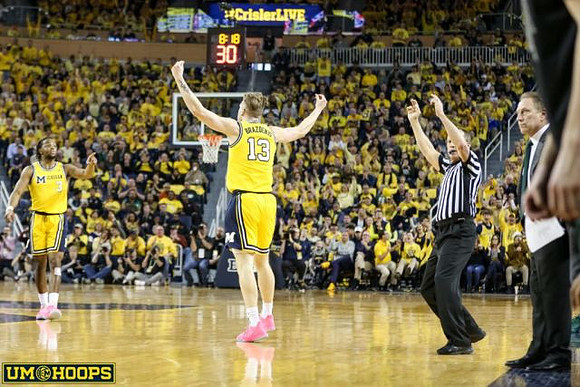 Zavier Simpson (3) and Ignas Brazdeikis (13)