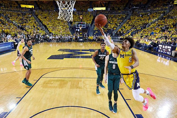 Jordan Poole (2), Ignas Brazdeikis (13), and Jon Teske (15)