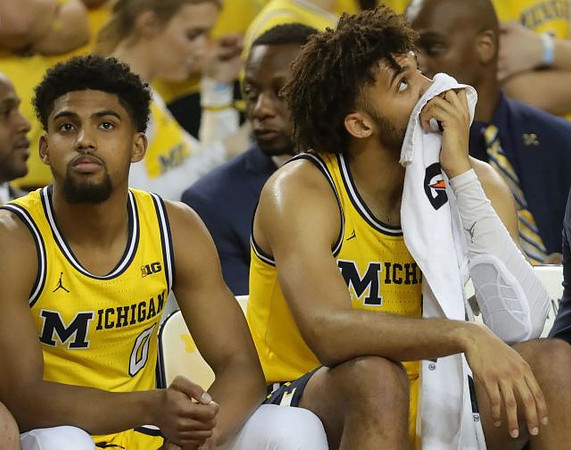 David DeJulius (0) and Isaiah Livers (4)