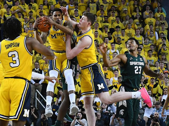 Zavier Simpson (3), Charles Matthews (1), and Jon Teske (15)