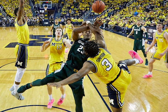Charles Matthews (1), Ignas Brazdeikis (13), Zavier Simpson (3), Jon Teske (15), and Jordan Poole (2)