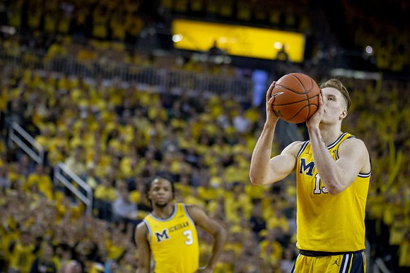 Zavier Simpson (3) and Ignas Brazdeikis (13)