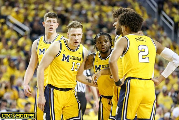 Jon Teske (15), Ignas Brazdeikis (13), Zavier Simpson (3), Isaiah Livers (4), and Jordan Poole (2)