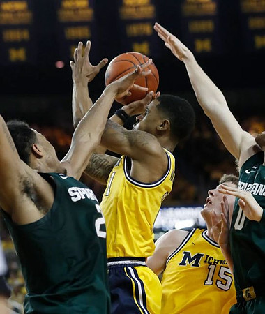 Charles Matthews (1) and Jon Teske (15)