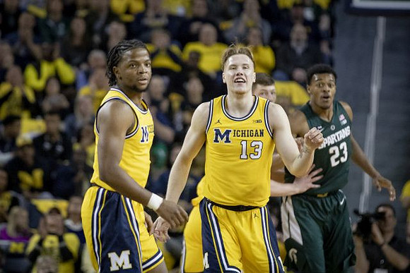 Zavier Simpson (3) and Ignas Brazdeikis (13)