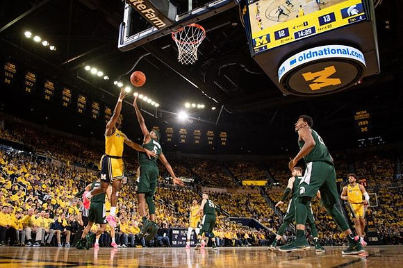 Zavier Simpson (3), Jordan Poole (2), and Isaiah Livers (4)