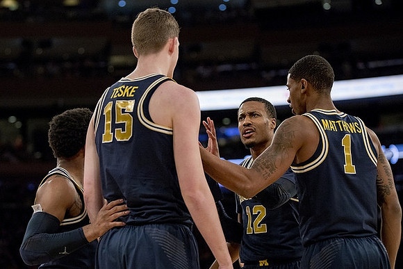 Zavier Simpson (3), Jon Teske (15), Muhammad-Ali Abdur-Rahkman (12), and Charles Matthews (1)