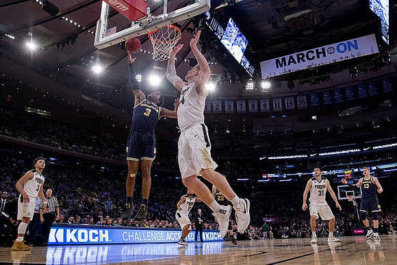 Zavier Simpson (3), Duncan Robinson (22), and Moritz Wagner (13)