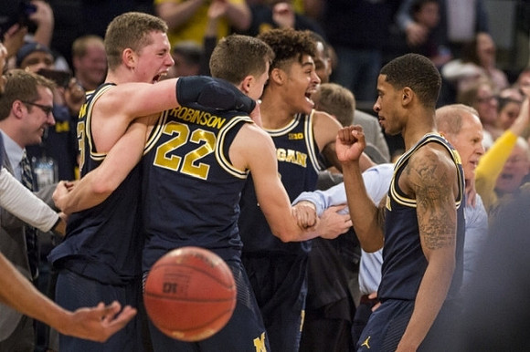 Moritz Wagner (13), Duncan Robinson (22), Jordan Poole (2), Charles Matthews (1), and John Beilein