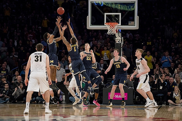Zavier Simpson (3), Charles Matthews (1), Duncan Robinson (22), and Jon Teske (15)