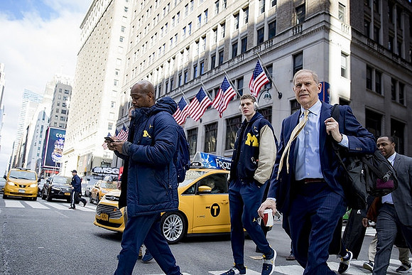 Deandre Haynes, Moritz Wagner (13), and John Beilein