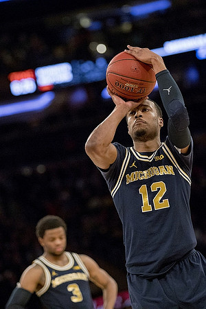 Zavier Simpson (3) and Muhammad-Ali Abdur-Rahkman (12)