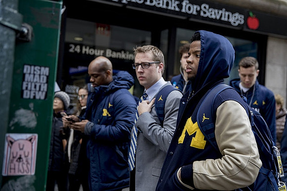 Deandre Haynes, Zavier Simpson (3), and Duncan Robinson (22)