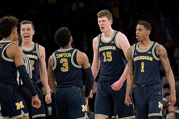 Jordan Poole (2), Duncan Robinson (22), Zavier Simpson (3), Jon Teske (15), and Charles Matthews (1)