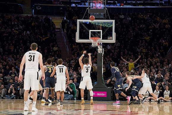 Zavier Simpson (3), Muhammad-Ali Abdur-Rahkman (12), and Duncan Robinson (22)