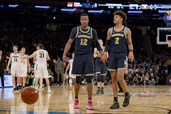 Muhammad-Ali Abdur-Rahkman (12) and Jordan Poole (2)