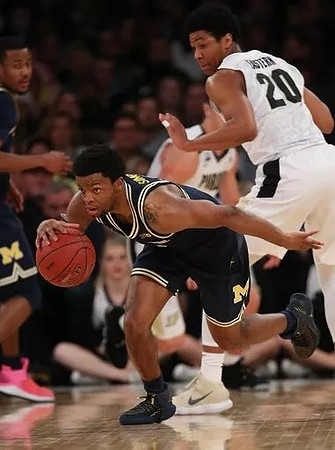 Muhammad-Ali Abdur-Rahkman (12) and Zavier Simpson (3)