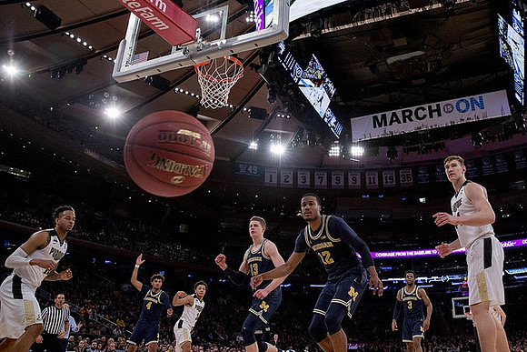 Isaiah Livers (4), Moritz Wagner (13), Muhammad-Ali Abdur-Rahkman (12), and Zavier Simpson (3)