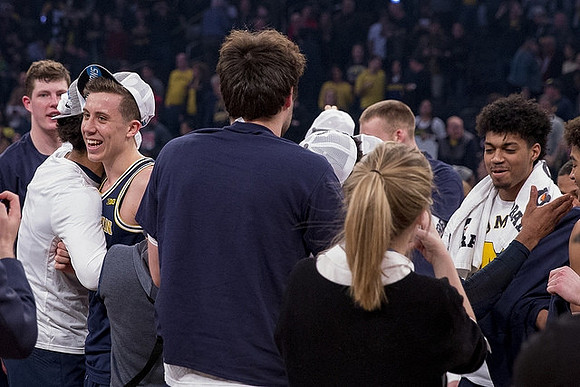 Jon Teske (15), Duncan Robinson (22), Brent Hibbitts (0), and Ibi Watson (23)