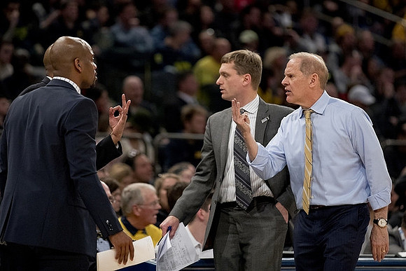 Deandre Haynes, Luke Yaklich, and John Beilein
