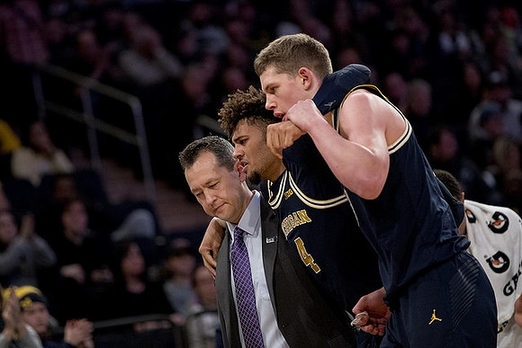 Isaiah Livers (4) and Moritz Wagner (13)