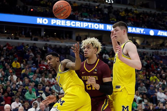Charles Matthews (1) and Jon Teske (15)