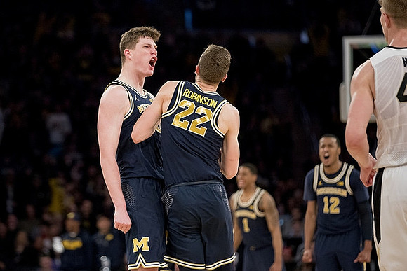 Jon Teske (15), Duncan Robinson (22), Charles Matthews (1), and Muhammad-Ali Abdur-Rahkman (12)