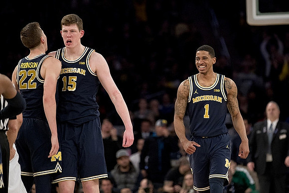 Duncan Robinson (22), Jon Teske (15), and Charles Matthews (1)