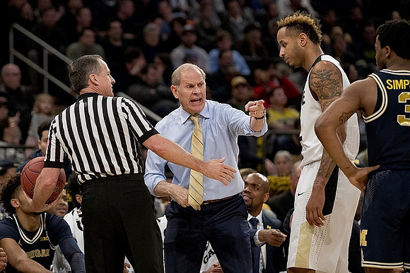 John Beilein and Zavier Simpson (3)