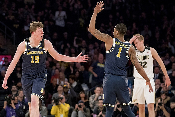 Jon Teske (15) and Charles Matthews (1)