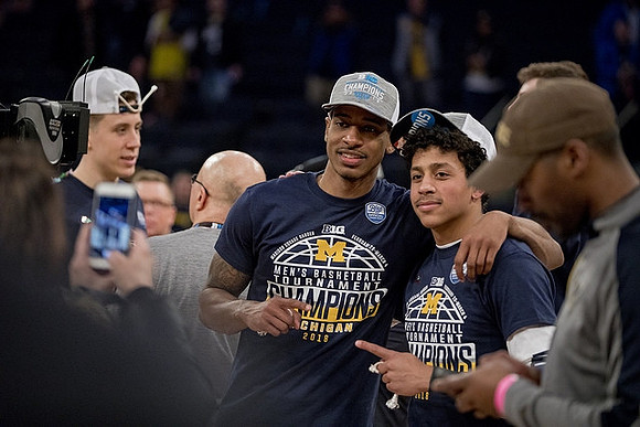 Duncan Robinson (22), Charles Matthews (1), and Eli Brooks (55)