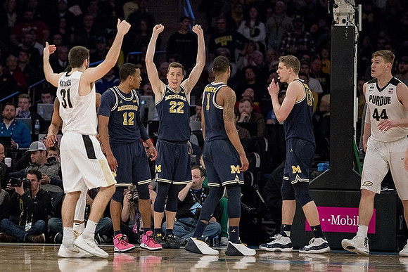 Muhammad-Ali Abdur-Rahkman (12), Duncan Robinson (22), Charles Matthews (1), and Moritz Wagner (13)