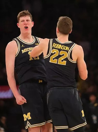 Jon Teske (15) and Duncan Robinson (22)